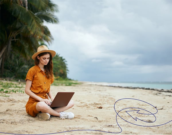 A person wearing a hat on the beach watching a funeral service recording on a laptop A person wearing a hat on the beach watching a funeral service recording on a laptop
